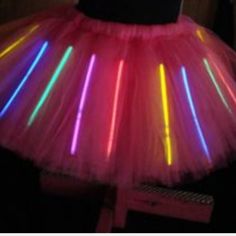 a pink tutu with neon lights on it