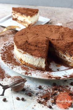 there is a chocolate cake on the plate with one slice cut out and ready to be eaten