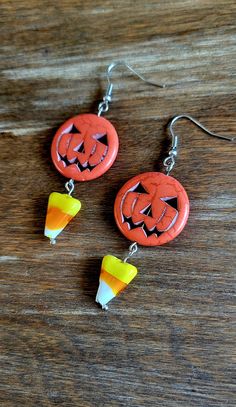 Halloween pumpkins and candy corn earrings. Fun Orange Halloween Jewelry, Fun Orange Jewelry For Halloween, Fun Halloween Dangle Earrings, Fun Orange Halloween Earrings, Fun Halloween Gift Earrings, Fun Halloween Earrings For Gifts, Fun Halloween Earrings Gift, Cute Orange Halloween Earrings, Fun Orange Earrings For Halloween