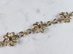 "A WOMEN'S VINTAGE ESTATE 14K YELLOW GOLD FLOWER BRACELET THAT WAS MADE IN ITALY. THE BRACELET MEASURES 7 1/2\" LONG BY ABOUT 7/8\" WIDE, AND WEIGHS 9.9g. THIS WOULD MAKE A LOVELY GIFT AND IS A GREAT VALUE FOR THE MONEY. IF ANY OTHER QUESTIONS, PLEASE ASK. BE SURE TO CHECK OUT SOME OF MY OTHER GREAT ITEMS UP FOR SALE. THANK YOU" Estate Jewelry Gold Stamped 14k, Gold Estate Jewelry Stamped 14k, Estate Style 14k Stamped Gold Jewelry, Formal Yellow Gold Costume Jewelry Bracelet, Formal Yellow Gold Flower Bracelet, Gold Flower Bracelet, Italian Bracelet, Bridal Gold Jewellery, Gold Flower