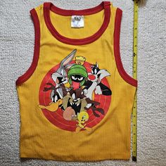 New Without Tags Looney Tunes Yellow With Red Trip Tank Top, Size Small. Yellow Playful Fitted Tops, Playful Fitted Yellow Tops, Fitted Playful Yellow Tops, Fitted Yellow Playful Tops, Fun Yellow Sleeveless Top, Harry Potter Tank Top, Bird Shirt, Small Tank, Black Sleeveless Top