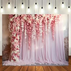 the backdrop is decorated with pink and white flowers