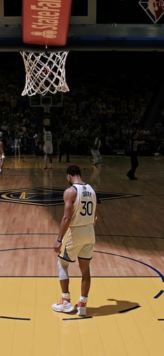 a man standing on top of a basketball court