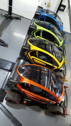 the cars are lined up and ready to be put in their respective race car livery