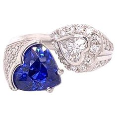 a heart shaped blue sapphire and diamond ring