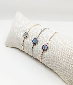 ⭐️Zirconia Evil Eye Bangle Bracelet is adjustable so it comfortably fits on any wrist. ⭐️Turkish jewelry is stainless steel. This evil eye charm bracelet is great for daily wear. For more evil eye bracelets, click the link below; https://www.etsy.com/shop/EyeDesignsbyGG?ref=search_shop_redirect&section_id=30219689 Adjustable Handcrafted Silver Cuff Bracelet, Adjustable Hand Set Silver Cuff Bracelet, Cubic Zirconia Adjustable Bracelets As Gifts, Adjustable Cubic Zirconia Bracelet As Gift, Cubic Zirconia Bracelets With Adjustable Length As A Gift, Cubic Zirconia Bracelets With Adjustable Length For Gifts, Adjustable Cubic Zirconia Bracelets, Adjustable Hand Set Bracelets, Adjustable Hand-set Bracelets