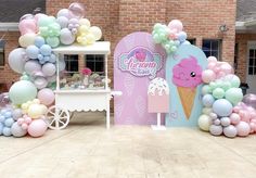 an ice cream parlor decorated with balloons and pastel colors for a birthday party or baby shower