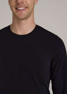 The Long Sleeve Tee Made for Tall Men Long Sleeve, Long on Style Experience everyday comfort with our Modern Fit Stretch Cotton Long Sleeve Tee for tall men. This tall long sleeve shirt combines stretch cotton for flexibility and a modern fit that looks and feels great. Whether you're reaching for the top shelf or stretching out on the couch, this extra-long top moves with you, maintaining its shape and your style.• Stretch cotton for ultimate comfort and mobility• Modern fit for a sharp, clean Black Relaxed Fit Cotton Long Sleeve Top, Black Cotton Relaxed Fit Long Sleeve Top, Black Cotton Long Sleeve Top With Relaxed Fit, Black Cotton Long Sleeve Top For Layering, Scrubs Dress, Athleisure Summer, Cozy Sleepwear, Tall Men, Sports Blazer