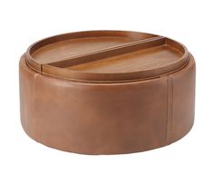 two round leather trays sitting on top of each other