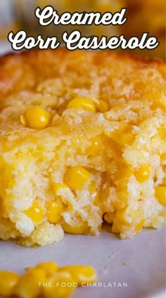 a corn casserole on a plate with text overlay