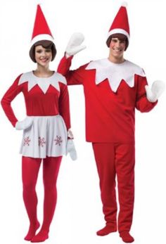 two people dressed in elf costumes standing next to each other