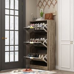 a shoe rack in the corner of a room next to a door with shoes on it