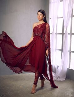 Maroon kurta with an embroidered drape and a pair of embroidered pantsFrom Shloka Khialani' s Fiorente collection.DELIVERY TIMEPlease allow 6-8 weeks for your outfit to arrive.FABRIC DETAILSSilk, Crepe, Georgette, NetProfessional cleaning only. Chanderi Sets With Cape Sleeves For Eid, Anarkali Embroidered Pant Set With Traditional Drape, Navratri Palazzo Set With Zari Work And Cape Sleeves, Anarkali Palazzo Set With Cape Sleeves For Navratri, Palazzo Set With Straight Kurta For Navratri Reception, Festival Palazzo Set With Dupatta And Cape Sleeves, Dabka Palazzo Set For Navratri Reception, Navratri Georgette Palazzo Set With Cape Sleeves, Navratri Sets With Resham Embroidery And Cape Sleeves