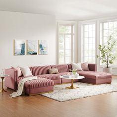 a living room with pink couches and white rugs