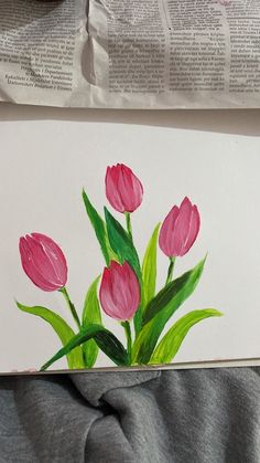 a drawing of pink tulips on top of a piece of paper