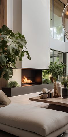 a living room with a couch, coffee table and fire place in the fireplace area