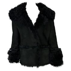 Presenting a fabulous black shearling Gucci oversized moto jacket designed by Tom Ford. From the early 2000s, this winter weather essential is constructed entirely of shearling with a thick fur lining. The fur on this jacket peaks at the seams and is used on the lapel and cuffs. Approximate measurements: Size - 42IT Shoulder to hem: 24" Bust: 42" Waist: 40" Shoulder to cuff: 27" Underarm to cuff: 20" Gucci Leather Jacket, Tom Ford For Gucci, Gucci By Tom Ford, Gucci Coat, Moto Style, Winter Weather, Jacket Design, Early 2000s, Moto Jacket