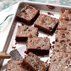 a pile of brownies sitting on top of a counter