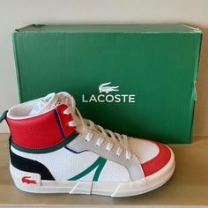 New In Box. Get Geared Up For The Weekend With The L004 Sneakers, A Dynamic Modern Sneaker With Sports Features You Will Appreciate. It Features The Tpu Lacoste Logo On The Heel And Is Completed With Lacoste's Signature Touch. A Refined Silhouette With Lace-Up Fastening, This Pair Supports The Foot For Optimum Speed And Impact. Main Material: 100% Cotton Sole Material Or Lining: Rubber Water Resistance: No Closure Type: Lace-Up Lacoste Shoes Mens, Navy Blue Sneakers, Lacoste Logo, Lacoste Shoes, Lacoste Sneakers, Black Leather Sneakers, Mid Top Sneakers, Casual Leather Shoes, Mens Shoes Black