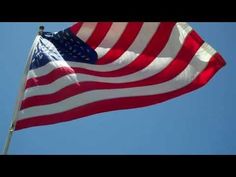 an american flag waving in the wind