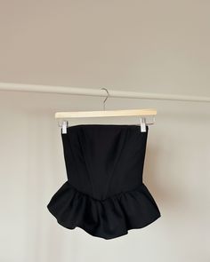 A timeless piece that exudes classic elegance and allure. Crafted from a luxurious black fabric, it combines beauty and structure to enhance your silhouette. Made from 100% cotton, even with steel boning it still offers the most  comfortable feel. Please note that each corset is handmade to order, and as such, it is not eligible for returns. Be sure to double-check all measurements. If not sure about sizing just put your measurements in the notes below to ensure the perfect fit. Handmade items c Elegant Fitted Strapless Corset, Elegant Strapless Fitted Corset, Elegant Stretch Corset For Date Night, Elegant Black Corset With Ruffles, Elegant Fitted Corset, Chic Stretch Corset With Boned Bodice, Elegant Stretch Corset With Boned Bodice, Elegant Fitted Ruffled Corset, Black Overbust Corset For Date Night