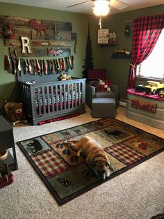 a dog laying in the middle of a room next to a baby crib and toys