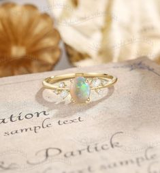 Natural Opal Engagement Ring, Twig Opal Ring, Oval Opal Ring Yellow Gold, Pear Moissanite Ring, Dainty Diamond Ring, Vintage Promise Ring Ring#: NC46321 Center stone: Opal oval cut 6*8mm Side stones: moissanite or diamond Shape: Pear cut 2*3mm, Round cut 1.3mm. Diamond grade: Color G-H , Clarity SI-VS Custom orders are most welcome! Please feel free to ask for any item, any adjustments or anything else you want me to make. Rush order Orders can be expedited for a fee. If your order needs to be e Oval Multi-stone Opal Ring For Anniversary, Oval Opal Promise Ring With Accent Stones, Oval Opal Ring With Prong Setting For Gift, Oval Opal Ring With Prong Setting, Oval Multi-stone Crystal Promise Ring, Oval Multi-stone Emerald Ring For Wedding, Opal Oval Diamond Ring With Gemstone, Oval Opal Diamond Ring With Gemstone Details, Oval Opal Diamond Ring With Gemstone