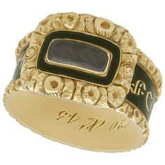 An impressive antique Victorian 1840s black enamel and 14 karat yellow gold mourning ring with hair; part of our diverse antique jewelry and estate jewelry collections. This fine and impressive antique Victorian mourning ring has been crafted in 14k yellow gold. The intricate design is ornamented with a push fit panel to the centre, displaying a woven hair panel. The woven hair panel is bordered by a plain black enamel decoration within a three dimensional floriated frame. The shank of the ring Victorian Hair, Antique Ring Box, Ring Boxes, Momento Mori, Romantic Jewellery, Antique Ring, Victorian Rings, Vintage Cocktail, Dress Rings