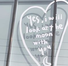 a window with a sign that says yes i will look at the moon with you