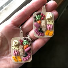 a pair of earrings that are made to look like food