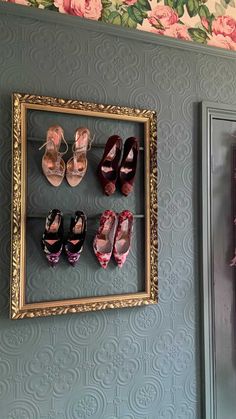 there are many pairs of shoes hanging on the wall