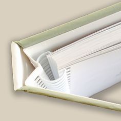 an open white box with papers in it