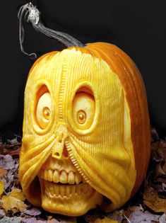 a carved pumpkin with an evil face on it