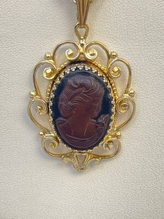 Whiting & Davis cameo carved glass pendant necklace Pendant measures 2" X 1.25" Gold tone chain necklace measures 21" end to end Excellent condition See pictures for additional details Luxury Heirloom Oval Pendant Necklace, Gold Carved Necklace For Formal Occasions, Antique Carved Necklaces For Formal Occasions, Ornate Cameo Necklaces For Formal Occasions, Vintage Gold Oval Pendant Jewelry, Vintage Oval Pendant Necklace, Cameo Costume Jewelry Necklace As Gift, Antique Cameo Necklace For Formal Occasions, Cameo Costume Jewelry Necklace For Gift