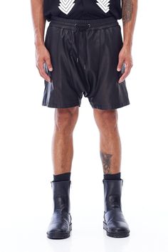 A unisex staple, JONNY COTA's new Drop Crotch Leather Shorts are handcrafted from luxe leather cut in a modern drop crotch silhouette. Wide elasticized waistband with cotton drawstring Backslash pocket 100% sheepskin leather 100% lining polyester Care instructions: Specialty cleanSIZE + FIT Loose, drop crotch fit Fits true to size