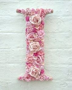 the letter i is made out of pink flowers