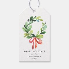 a watercolor christmas gift tag with the words happy holidays on it