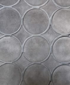 a close up view of cement circles on the ground