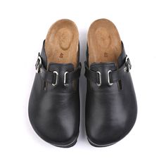 a pair of black shoes with buckles on them