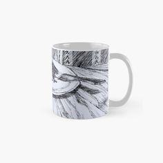 a coffee mug with a drawing on it