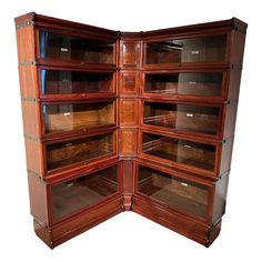 an open wooden bookcase with many shelves