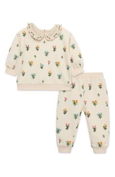 An allover floral print brings sweet flourish to this matching set that'll keep baby comfortable and cute no matter what the day brings. Top has back keyhole with button-and-loop closure; bottoms have elastic waist 79% cotton, 21% polyester Machine wash, tumble dry Imported Printed Playwear Sets For Spring, Spring Printed Sets For Playtime, Printed Sets For Playtime In Spring, Cotton Playtime Sets With Floral Print, Cotton Floral Print Playtime Sets, Spring Printed Playtime Sets, Playful Floral Print Sets For Playtime, Casual Floral Print Playtime Sets, Casual Floral Print Sets For Playtime