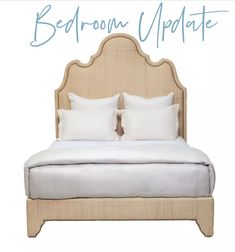 a bed with two pillows on it and the words bedroom update written in blue ink