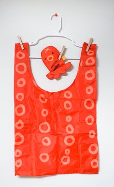 OCTOPUS REUSABLE SHOPPING BAG OCTOPUS pouch that holds a shopper bag for all your daily carrying item needs.The salmon pouch may be used for small trinkets as well. DIMENSIONS: fish bag: 7" (fish pouch 5") shopper bag: 25 ½" × 15 ½" × 6" 100% ripstop nylon safely holds roughly 30lbs WASHING INSTRUCTIONSMachine cold wash/hand wash and hang dry Designed by Ohmonah. Social: Check out @ohmonah on twitter and instagram for more updates! Eco Bags, Fish In A Bag, Creative Idea, Reusable Shopping Bags, Shopper Bag, Cool Items, Design Inspo