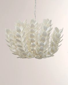 a white chandelier hanging from a ceiling