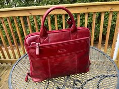 Super nice and elegant wine color handbag by Overland It is vintage in excellent condition It is 14" long by 12" tall Burgundy Rectangular Satchel For Business, Burgundy Top Handle Satchel For Business, Red Laptop Satchel Bag, Red Rectangular Briefcase, Red Top Handle Bag For Business, Red Top Handle Business Bag, Red Leather Lined Shoulder Bag For Business, Business Red Shoulder Bag With Leather Lining, Burgundy Business Bag With Top Carry Handle