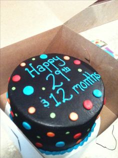 a birthday cake is in a box on the table