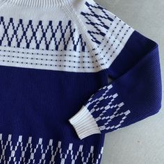 "Blue and white ski type acrylic knit pullover sweater by JC Penney Construction: raglan sleeve, ribbed knit hems, thick knit Fabric: thick knit acrylic Tags: 100% Acrylic / JC Penney / Made in Taiwan / L / Machine Wash Gentle Condition: very nice and clean. does have a small faint spot. Size: Large see measures. has moderate stretch. c1980s 1970s Measures: Shoulders: raglan sleeve Bust/ chest: 44\" Waist: 42\" Hip: 38\" Length: 26\" Sleeves: 30\" from neck band Visit the store! www.etsy.com/sho Navy Ribbed Sweater For Winter, Blue Nordic Knit Sweater, Nordic Blue Crew Neck Sweater, Retro Ribbed Knit Sweater, Blue Nordic Crew Neck Sweater, Blue Fair Isle Sweater For Cold Weather, Acrylic Tags, White Pullover, Vintage Sweater