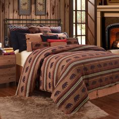 a bed room with a neatly made bed and a fire place