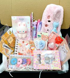 a box filled with lots of cute items